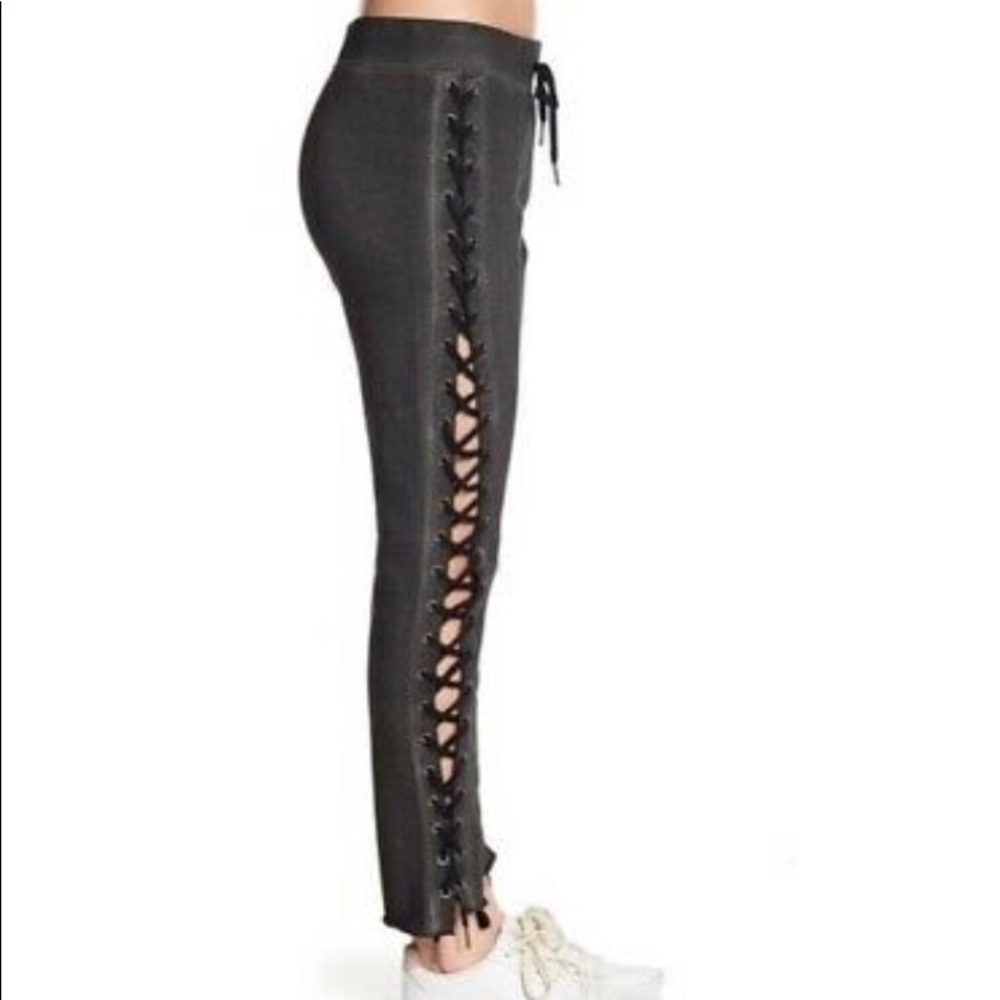 Pam and Gela laced up charcoal sweat pants.